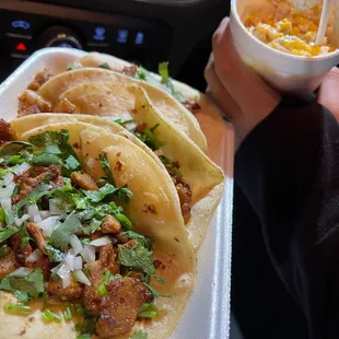 Tacos al pastor and elote