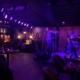 a band performing in a dimly lit room