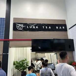 people standing in line at counter