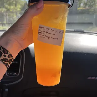 Passion fruit green tea with passion fruit popping boba unsweetened