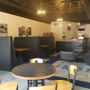 a dining area with tables and chairs