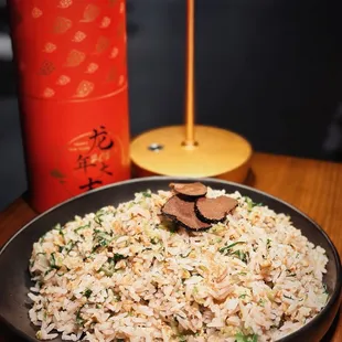 a plate of rice and vegetables on a table