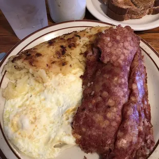 Eggs, corned beef hash, and home fries.