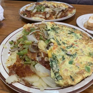Omelette and potatoes with onions and peppers.