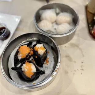 Jumbo Shrimp Har - gow (top) and Scallop Squid Inked Dumplings (bottom)