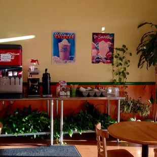 a coffee shop with tables and chairs