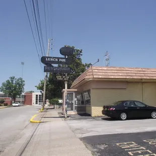 a car parked in front of the restaurant