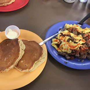 Pancakes accompanied by steak omelette. (Hot sauce as per my preference).