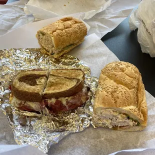 two sandwiches on tin foil