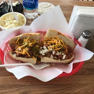 Amazing chili cheese dog with all the fixings.