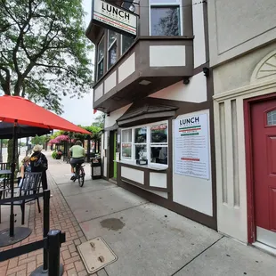 people walking down the sidewalk