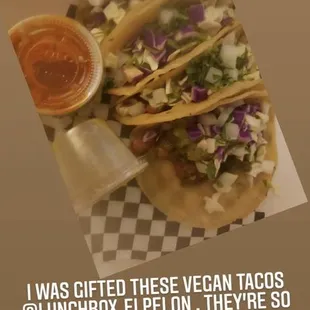 a plate of tacos with sauce