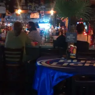 Friendly happy group of people enjoying a lazy afternoon at luncheonmeat louies bar