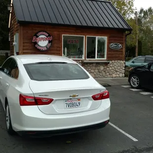 a white car parked in a parking lot