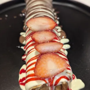 a chocolate covered dessert with strawberries