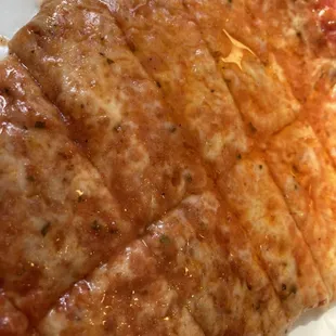 Slice of plain pizza cut into tiny pieces for me to eat