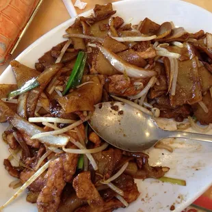 a plate of food with a spoon