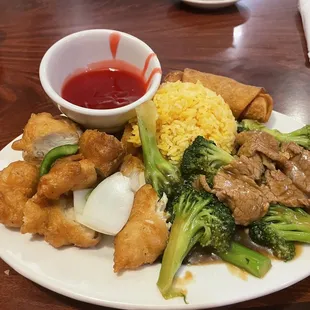 Combination of sweet and sour chicken and beef with broccoli