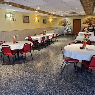 a dining room with tables and chairs