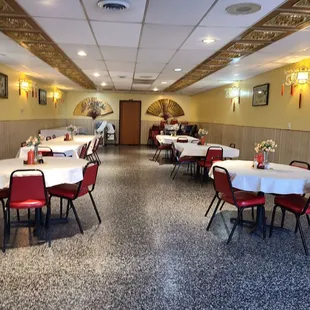 a dining room with tables and chairs