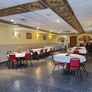 a dining room with tables and chairs