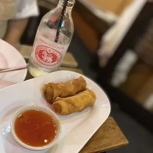 a plate of food with dipping sauce