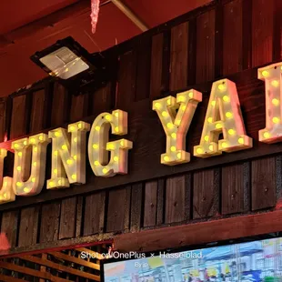 a neon sign for lung yai