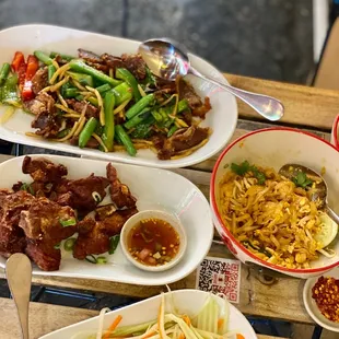 Pad Thai chicken , papaya salad, fried ribs, and crispy basil duck