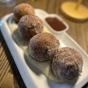 Gluten free Bomboloni with caramel sauce and vanilla cream! Divine!