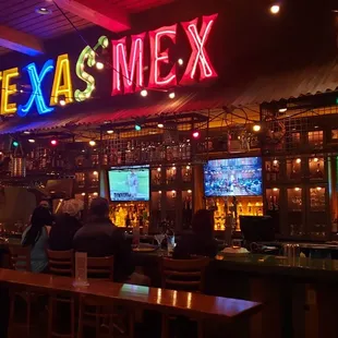 people sitting at the bar