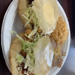 Gorditas o papas con chorizo and their money beans and rice.