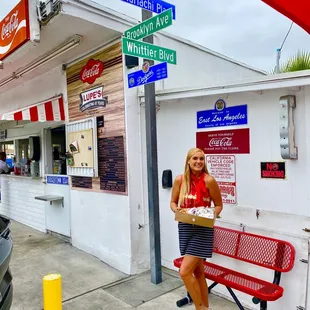 a woman sitting on a bench
