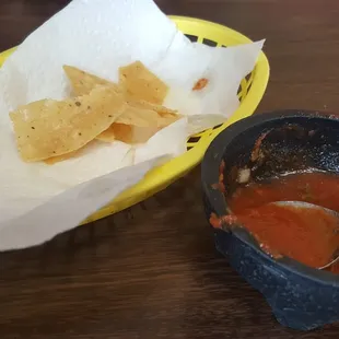 a bowl of salsa and a bowl of tortilla
