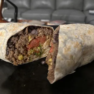 Burrito with Barbacoa and pico, black beans, cilantro and the amazing spicy pickled onions
