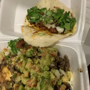 Taco al pastor and nachos ranchero (carne asada) asked for avocado on top (other option to the side)
