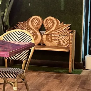 Super cute bench carved in the shape of swans