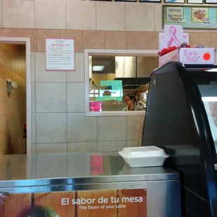 Fresh tortillas being made in the back.