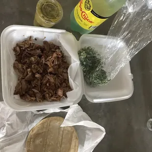 Carnitas. Cilantro/Onion. Tortillas. Salsa Verde (spicy!). Topo Chico.
