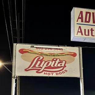 Sign above the food truck and tent