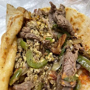 Inside of the hippo breakfast taco with beef fajita