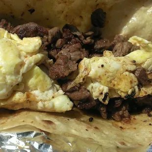 Carne asada and egg breakfast taco.