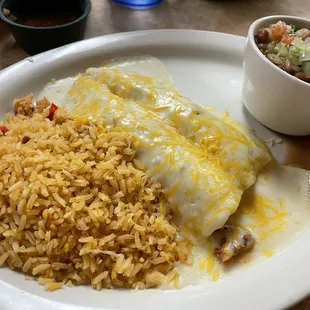 Fajita enchiladas with rice and Barracho beans. I filled my enchiladas with fajita chicken, smothered with sour cream sauce.