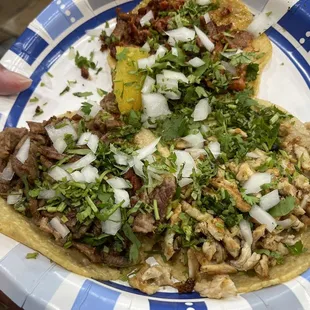Al pastor, carne asada, and chicken tacos using freshly made corn tortillas