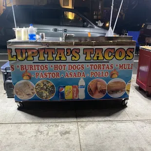 a food cart on the sidewalk
