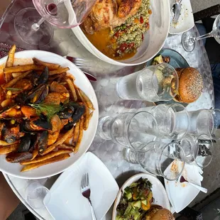 a table full of food and wine glasses