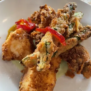 Buttermilk fried halibut, squid, asparagus, and mushrooms