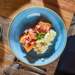 a plate of food on a wooden table