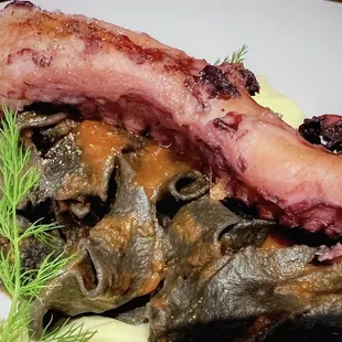 GRILLED OCTOPUS OVER SQUID INK PASTA