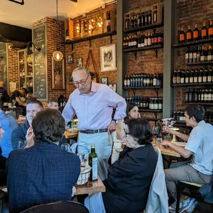 a group of people sitting around a table