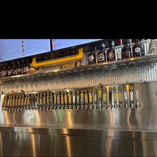 a row of beer taps